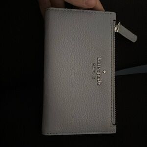 A baby blue Kate spade wallet